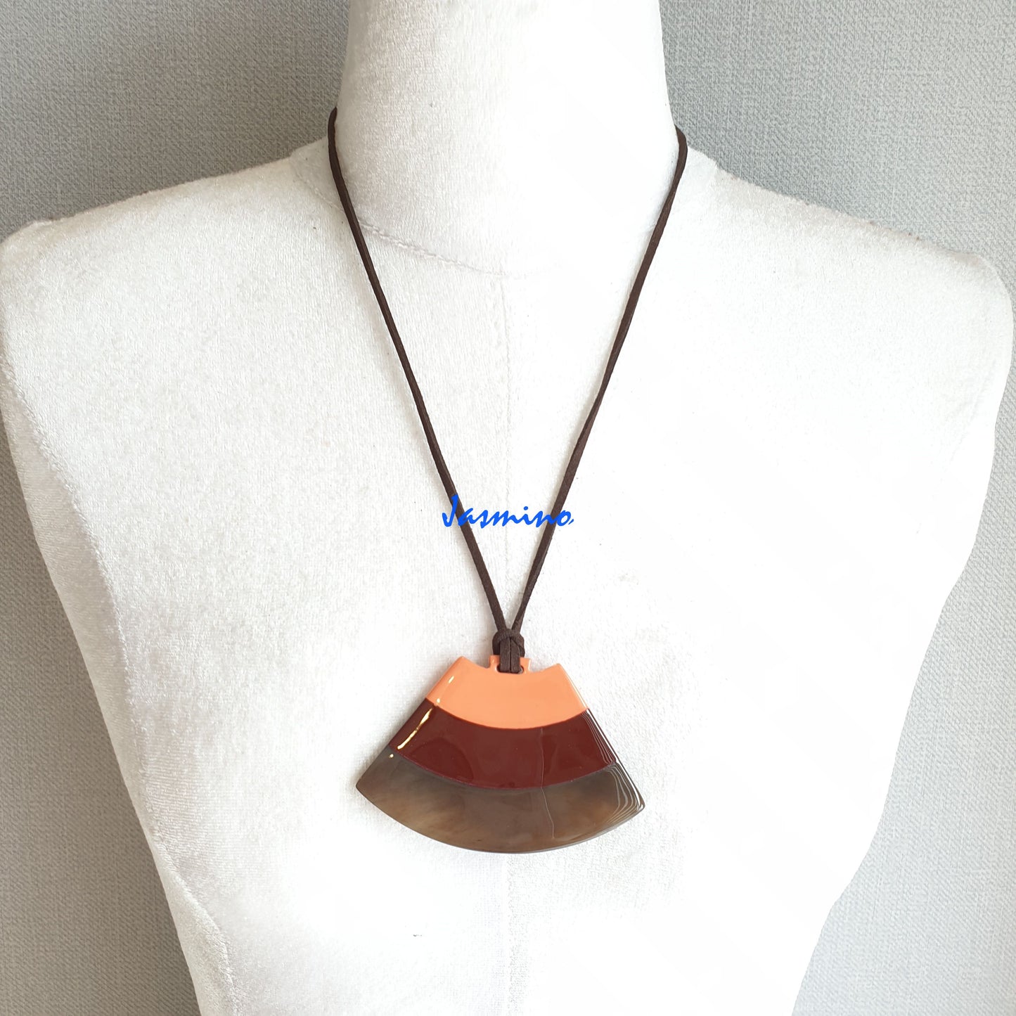 salmon lacquer pendant on the light background, impressive gift for her