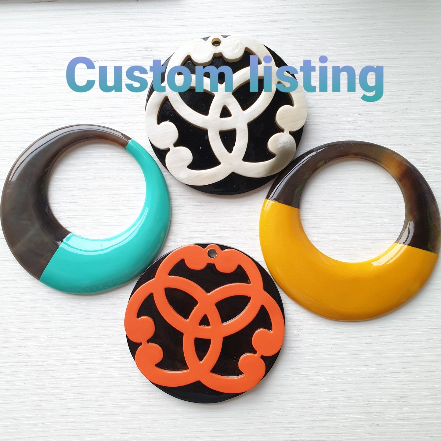 Four Jasmino unique handmade customized circle pendants feature bright colours in natural buffalo horn for women