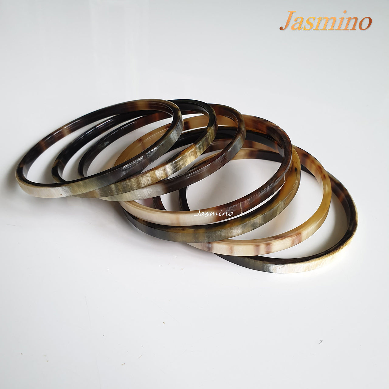 <img src="buffalo horn bracelet.jpg" alt="set 7 natural horn bracelets on the light background, impressive gift for her">