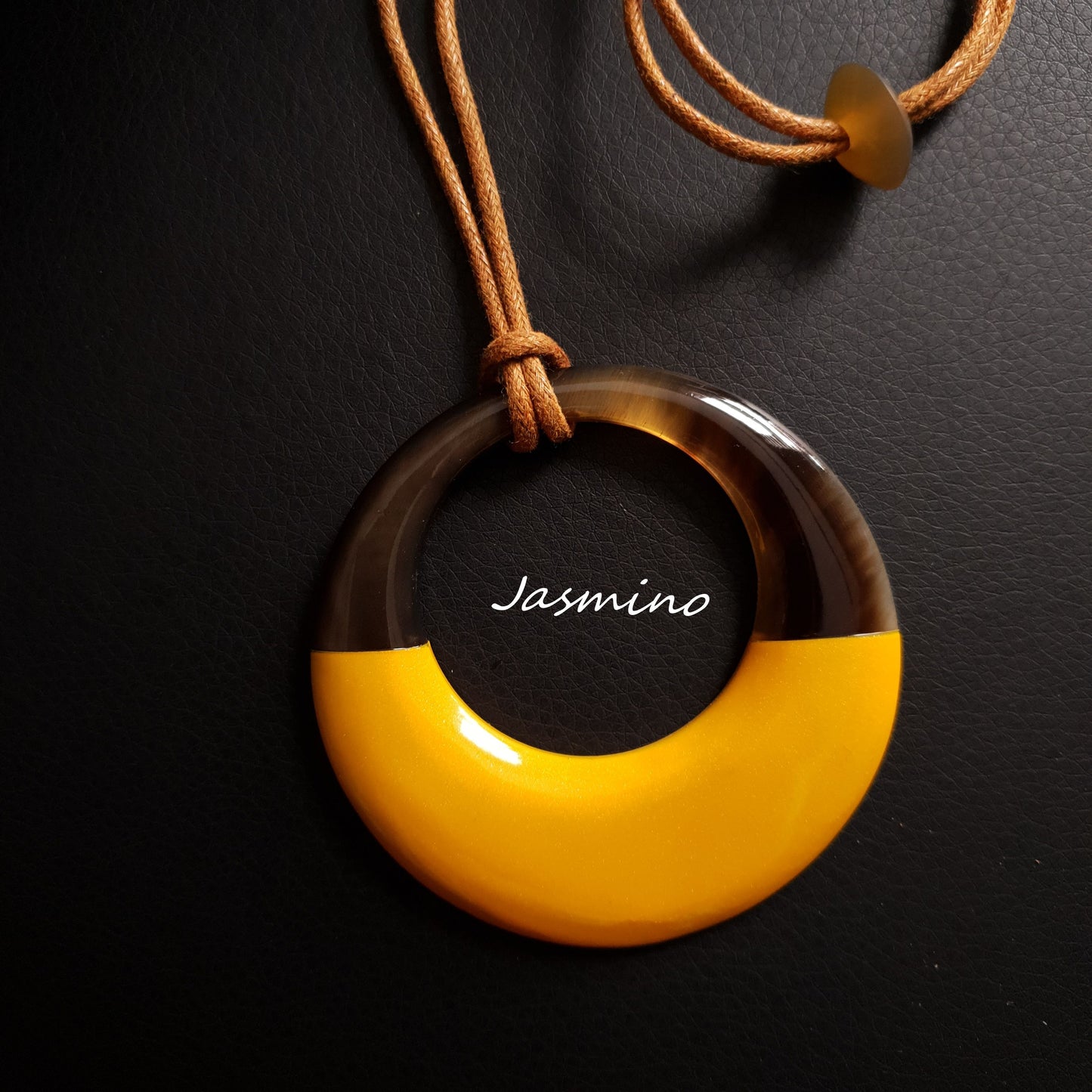 circle pendant is designed with the top half of a natural buffalo horn and the bottom half is painted bronze on the dark background, unique gift for her