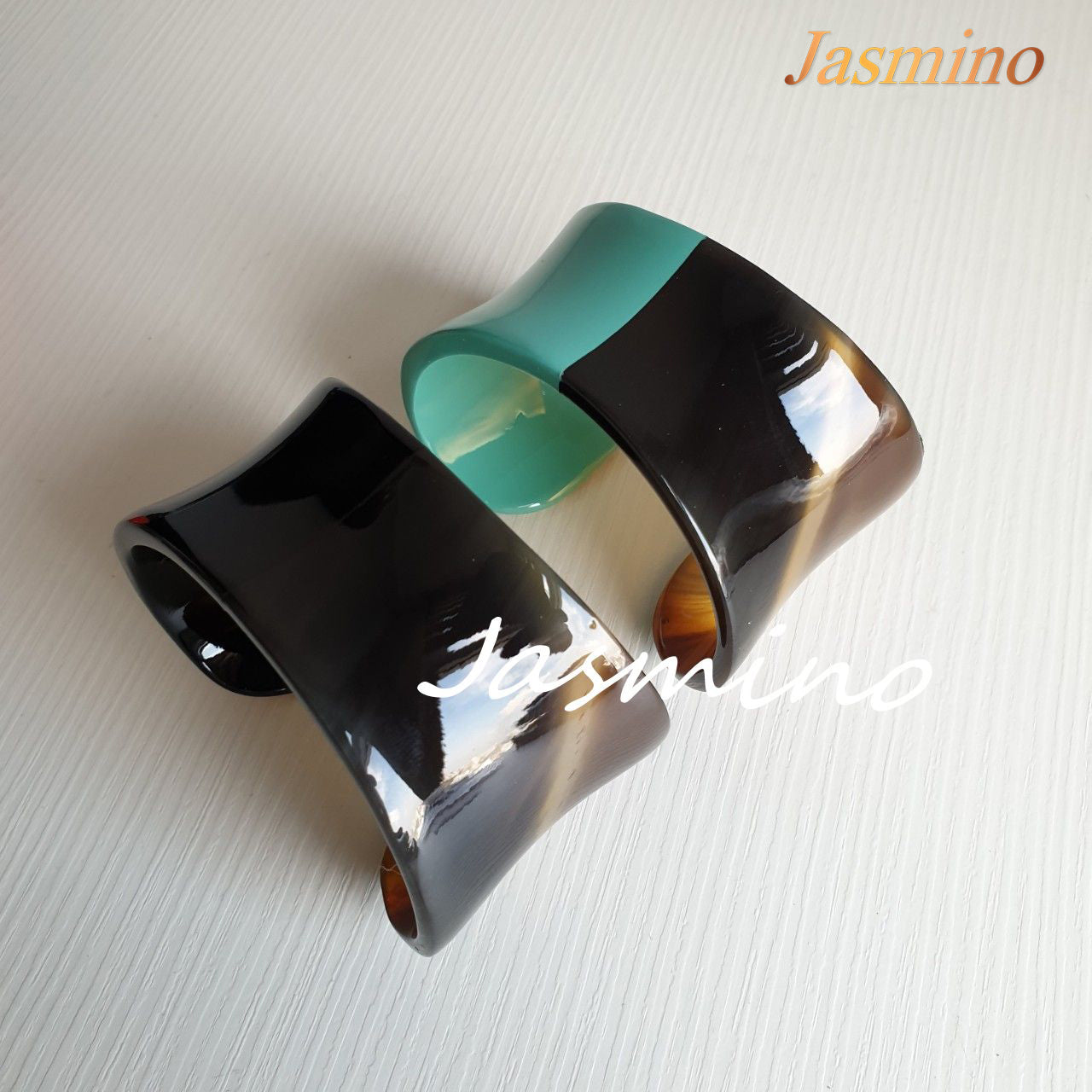 two cuff bracelets are designed with half natural horn and half biscay green lacquer, unique gift for her