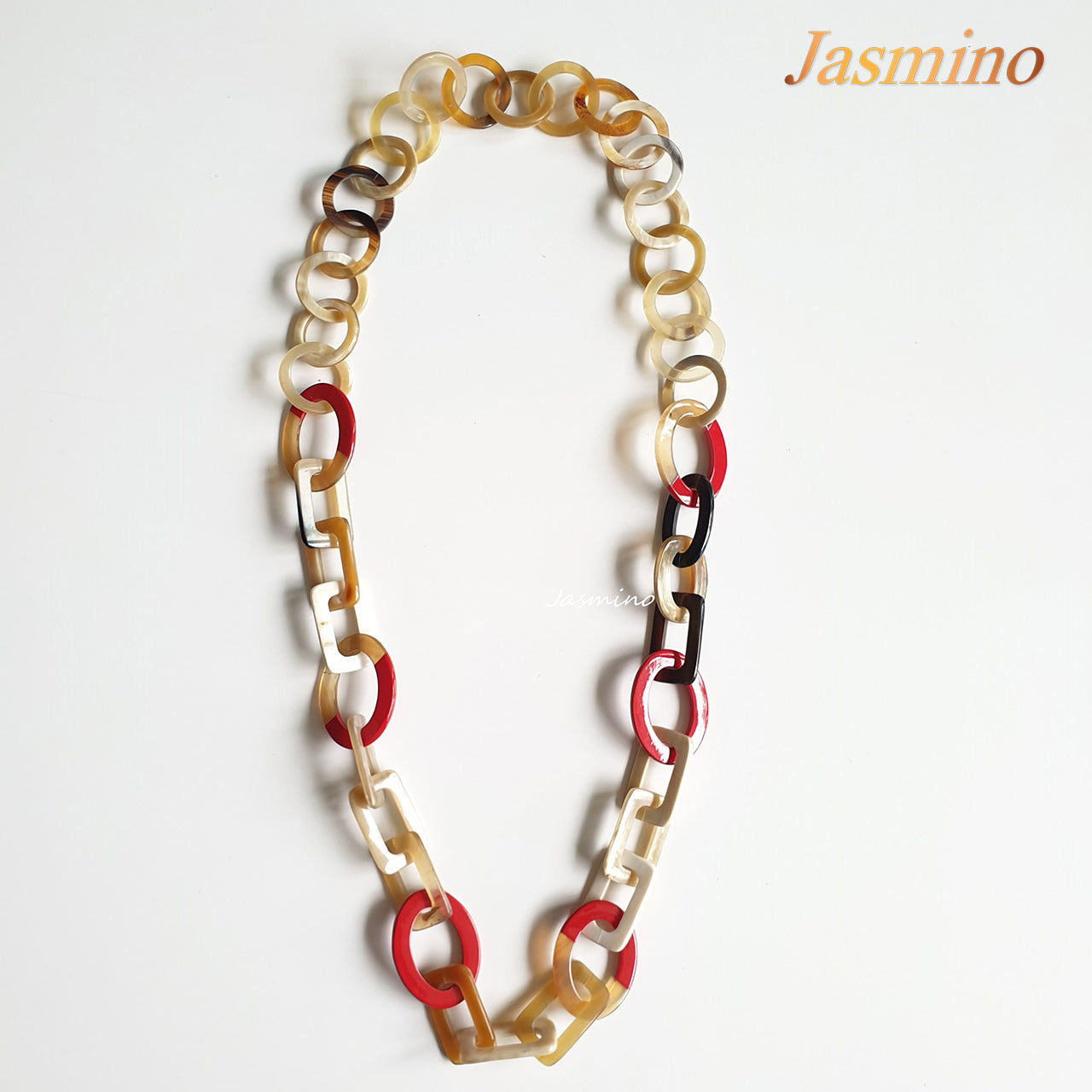 The necklace consists of pieces of natural buffalo horn: circle pieces, rectangle pieces and elliptical flame scarlet pieces connected together with each other, impressive gift for your friend