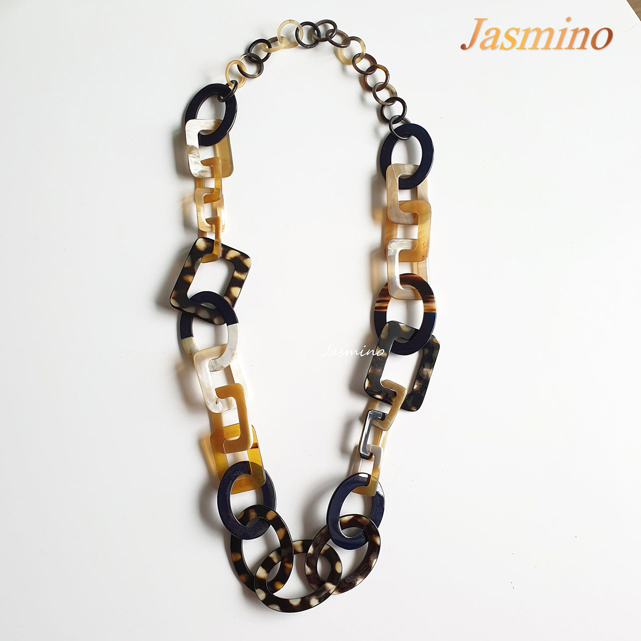 The necklace consists of pieces of natural buffalo horn: circle pieces, rectangle pieces and elliptical blue pieces connected together with each other, impressive gift for your friend