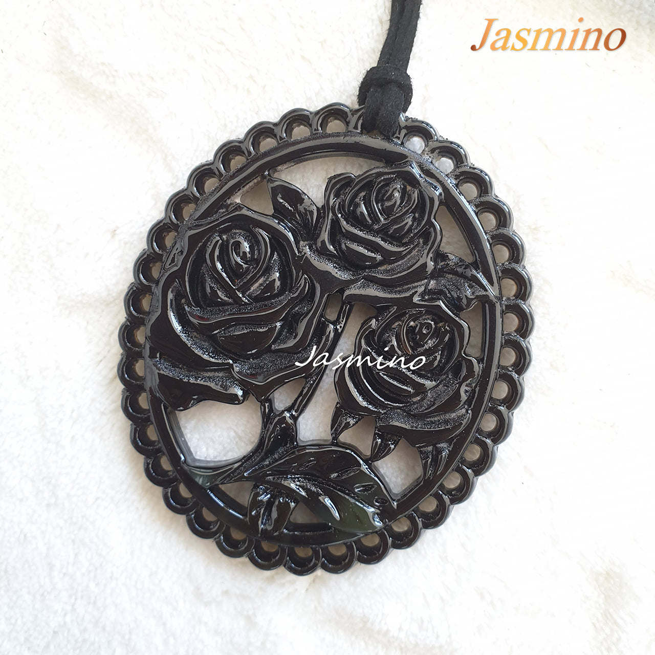 Elliptical pendant with unique dark pattern with rose shape on the light background, impressive gift for her