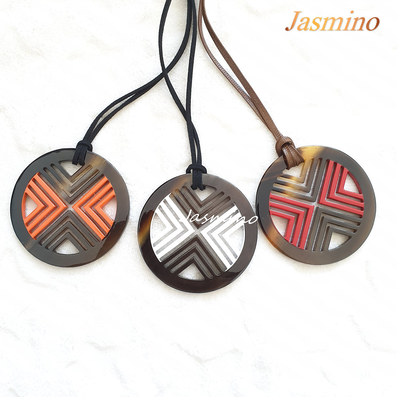 three circle pendants on the light background, impressive gift for your friend