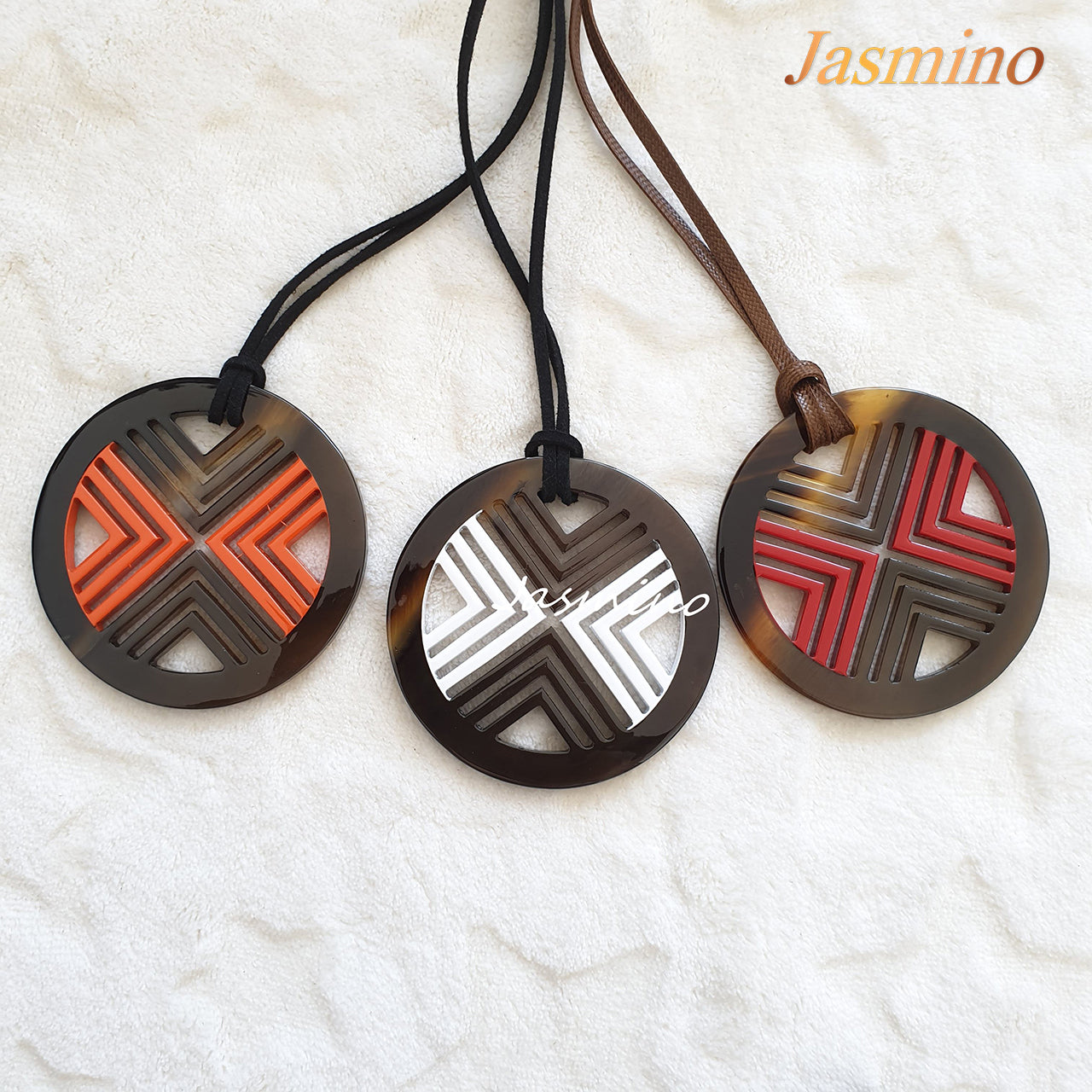 three circle pendants on the light background, impressive gift for your friend