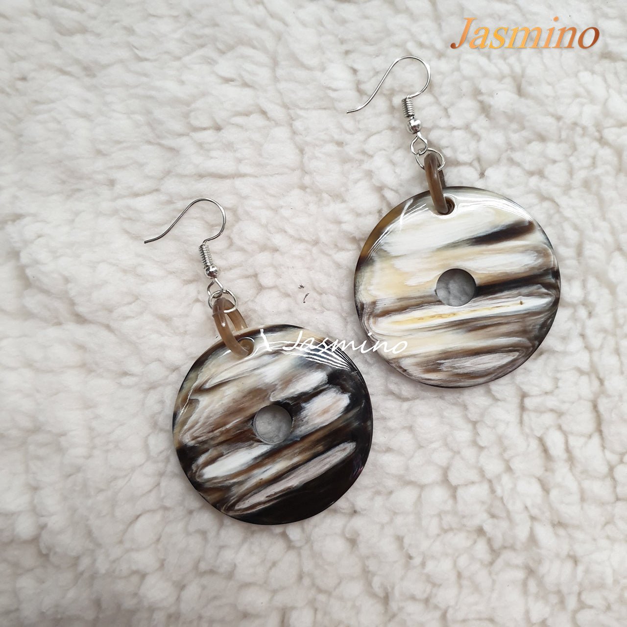 Jasmino unique handmade dangle earrings are shaped by a cake donut shape, made of natural buffalo horn