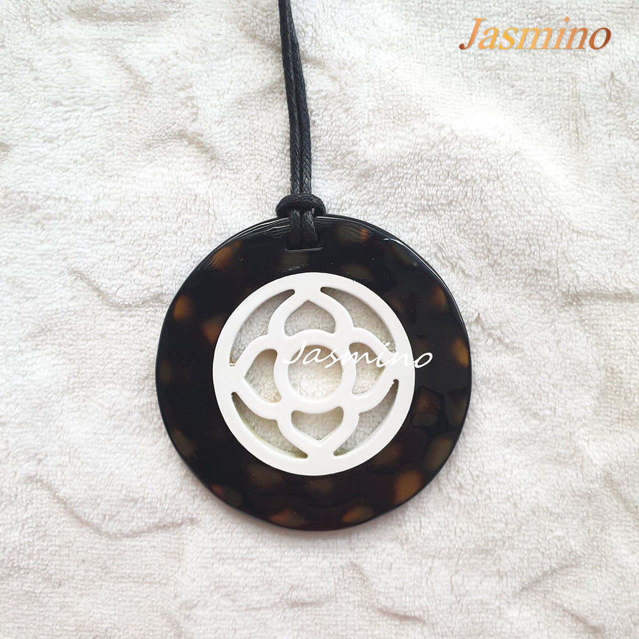 natural horn pendant with an brilliant white circular pattern in the center, impressive gift for her