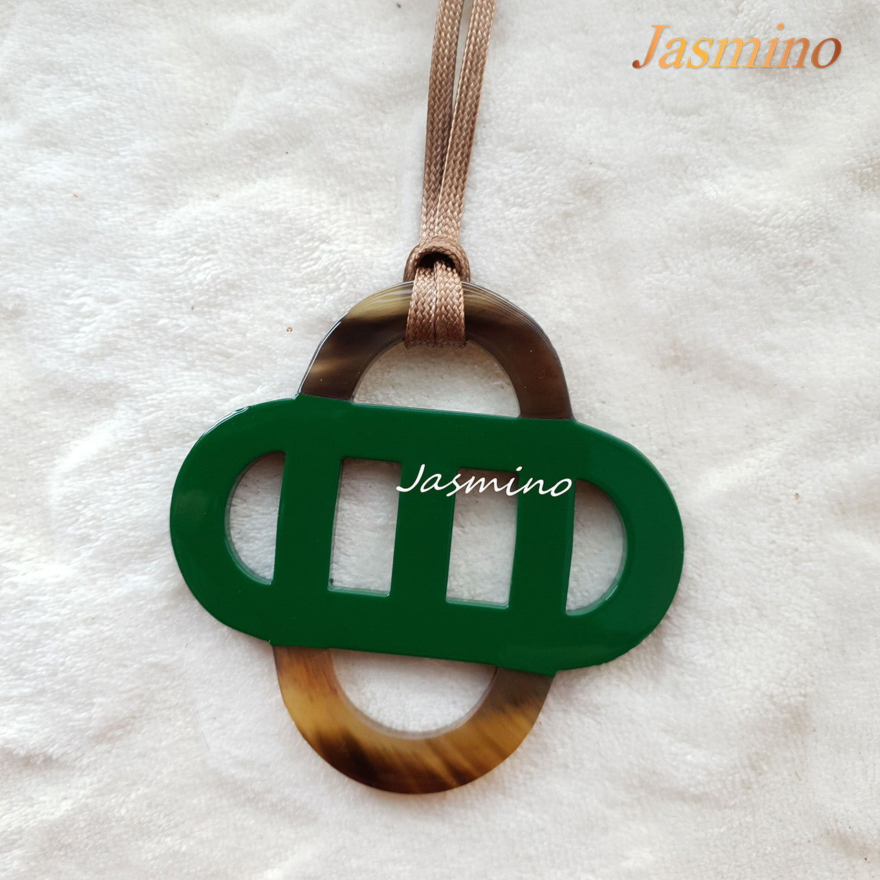 unique green lacquer pendant on the light background, impressive Christmas gift for her