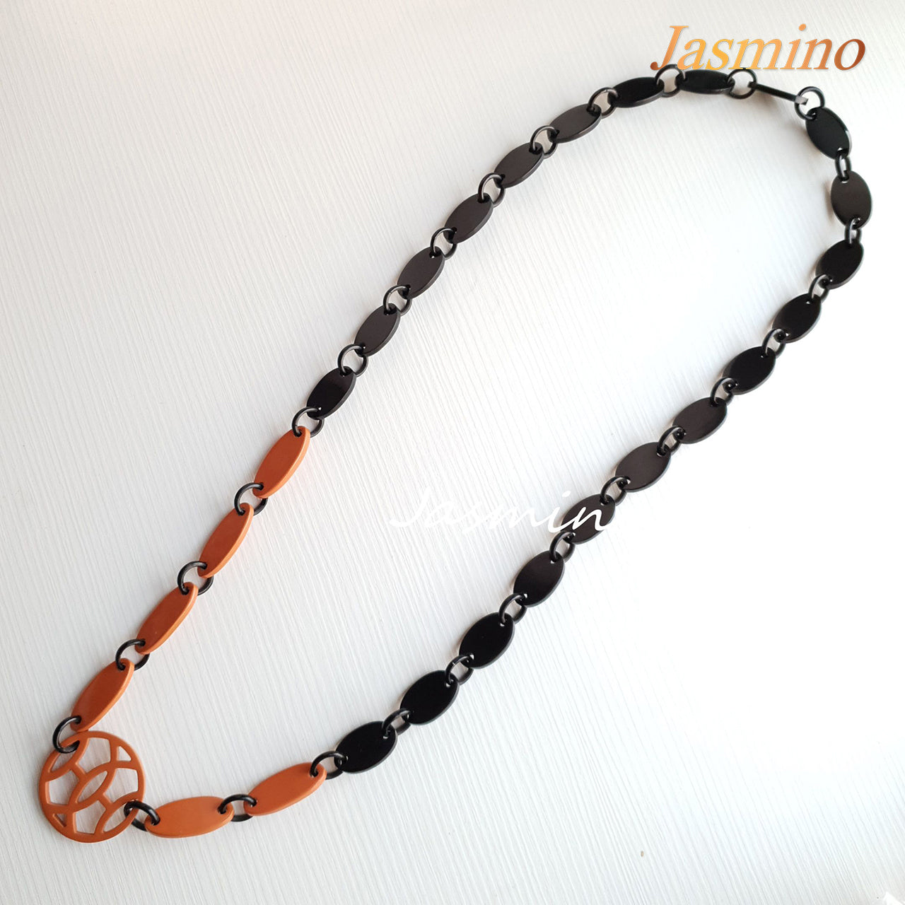 <img src="buffalo horn necklace.jpg" alt="The necklace has several orange peel pieces, unique gift for her">