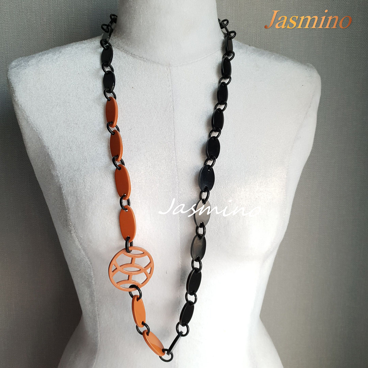 <img src="buffalo horn necklace.jpg" alt="The necklace has several orange peel pieces,  unique gift for her">