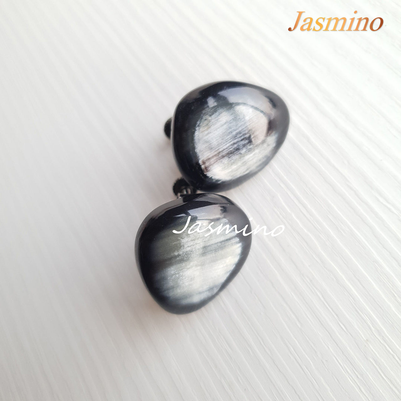 Polished Vintage gemstone cluster earrings feature black and white in the natural light