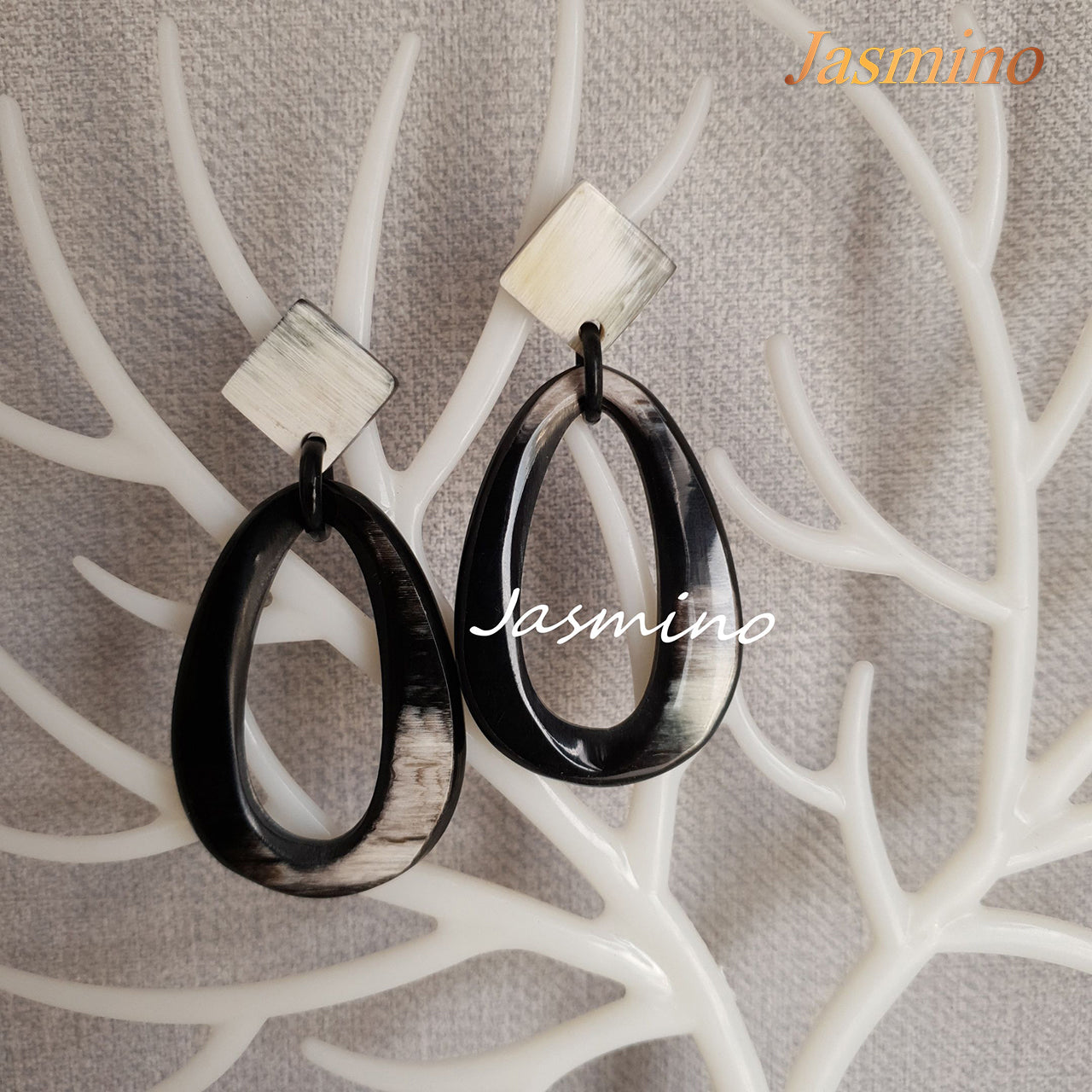 <img src="buffalo horn earrings.jpg" alt="natural horn earrings on the light backgrourd, unique gift for your friend">