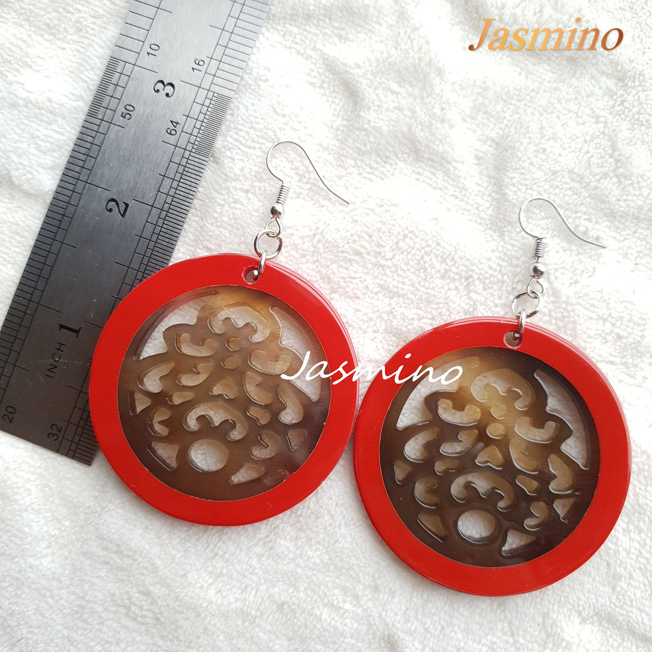 Beautiful unique floral circle dangle earrings feature red and brown in the natural light as Christmas gifts