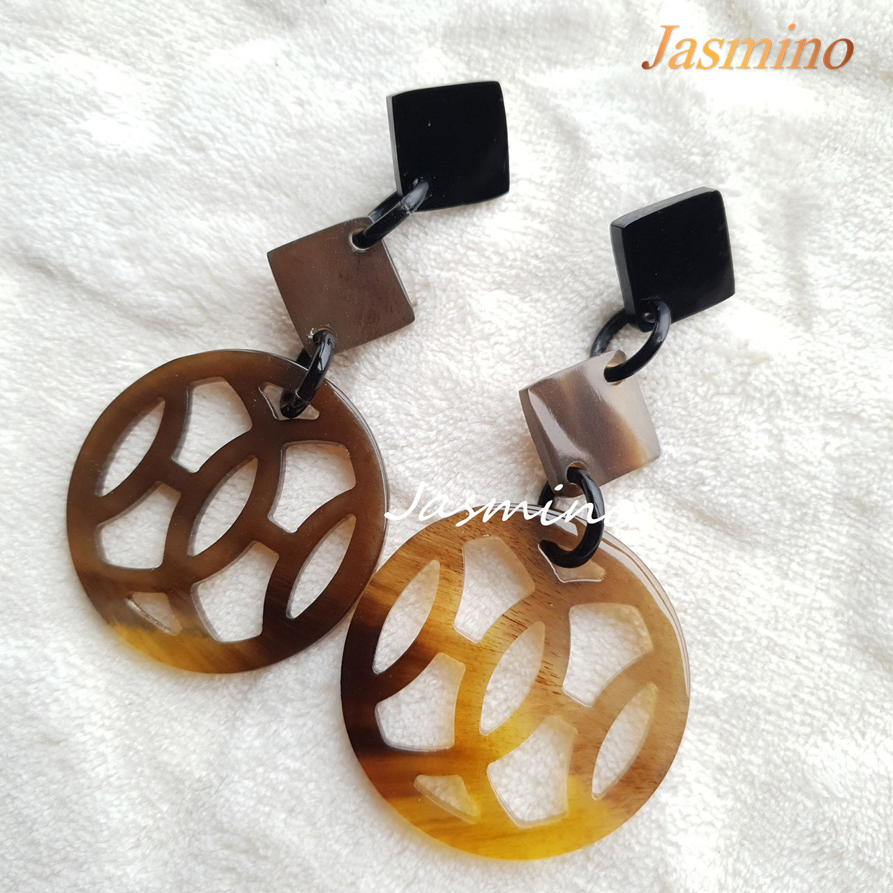 Asian Vintage stained glass window earrings feature a circle shape and brown color in the natural light