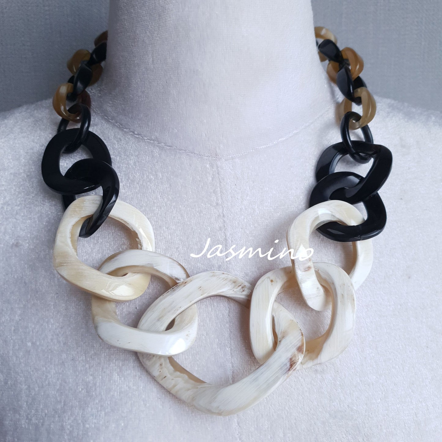 natural horn necklace on the light background, unique gift for your friend