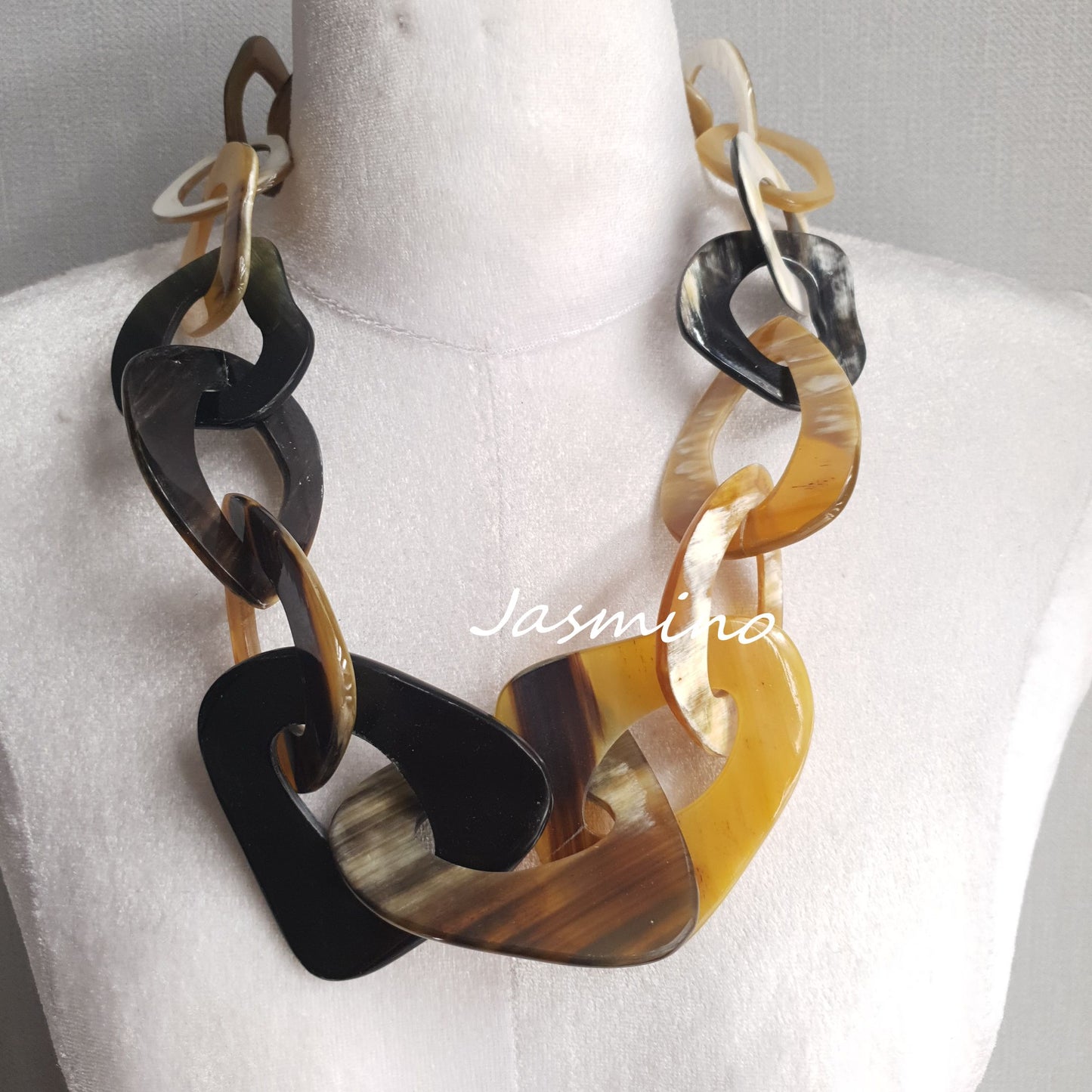 rustic natural buffalo horn necklace on the light background - 50cm