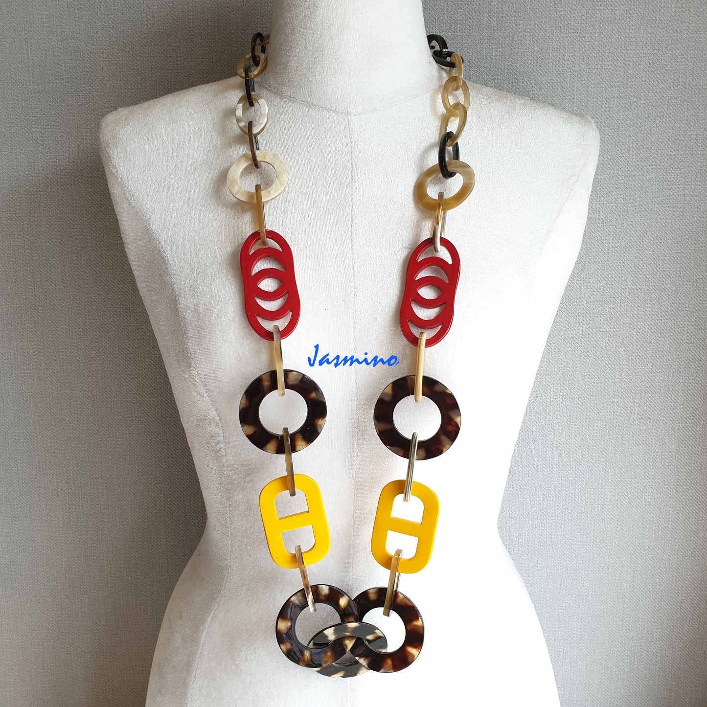 The necklace has several large flame scarlet and vibrant yellow pieces in natural light, impressive gift for her