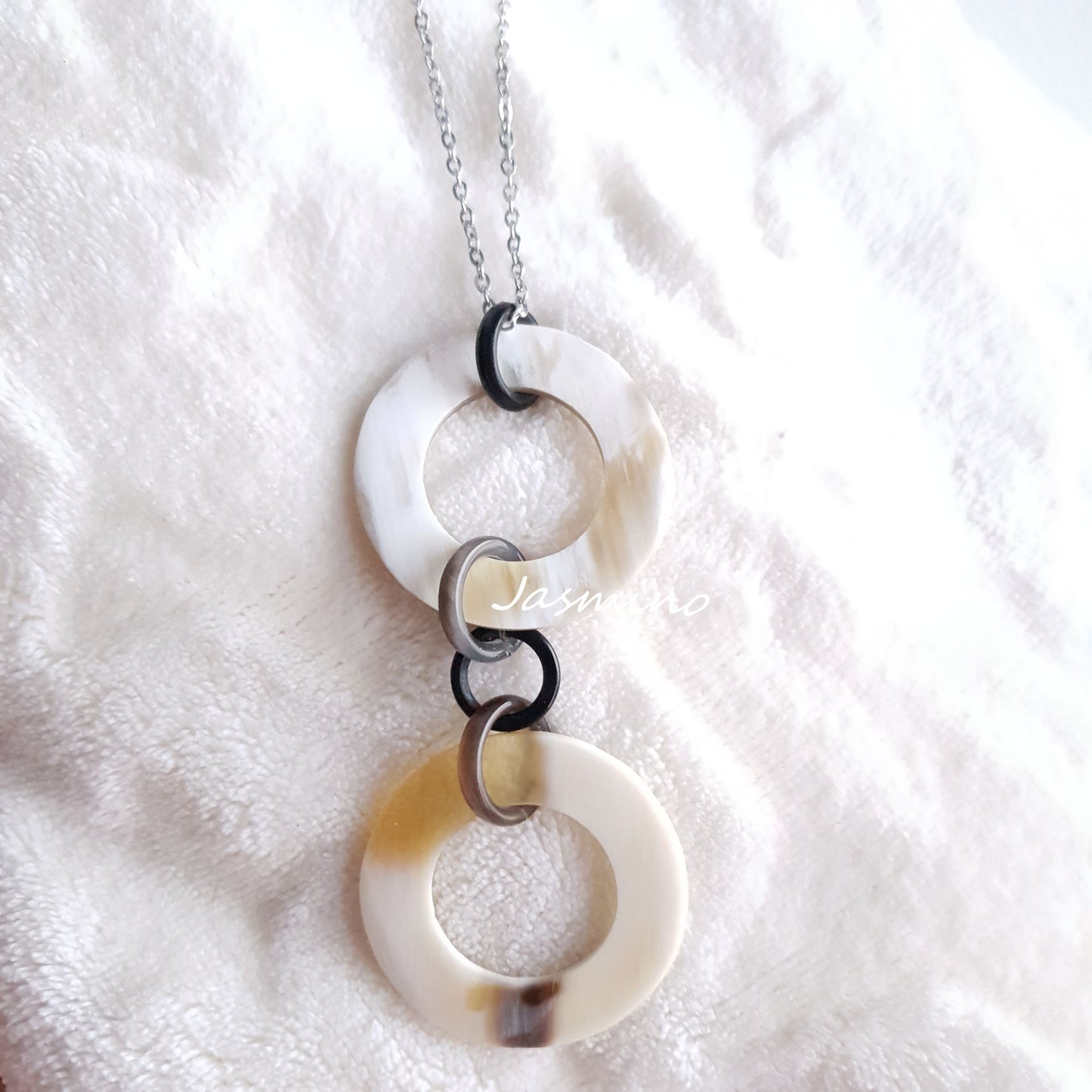 natural horn necklace on the light background, unique gift for your friend