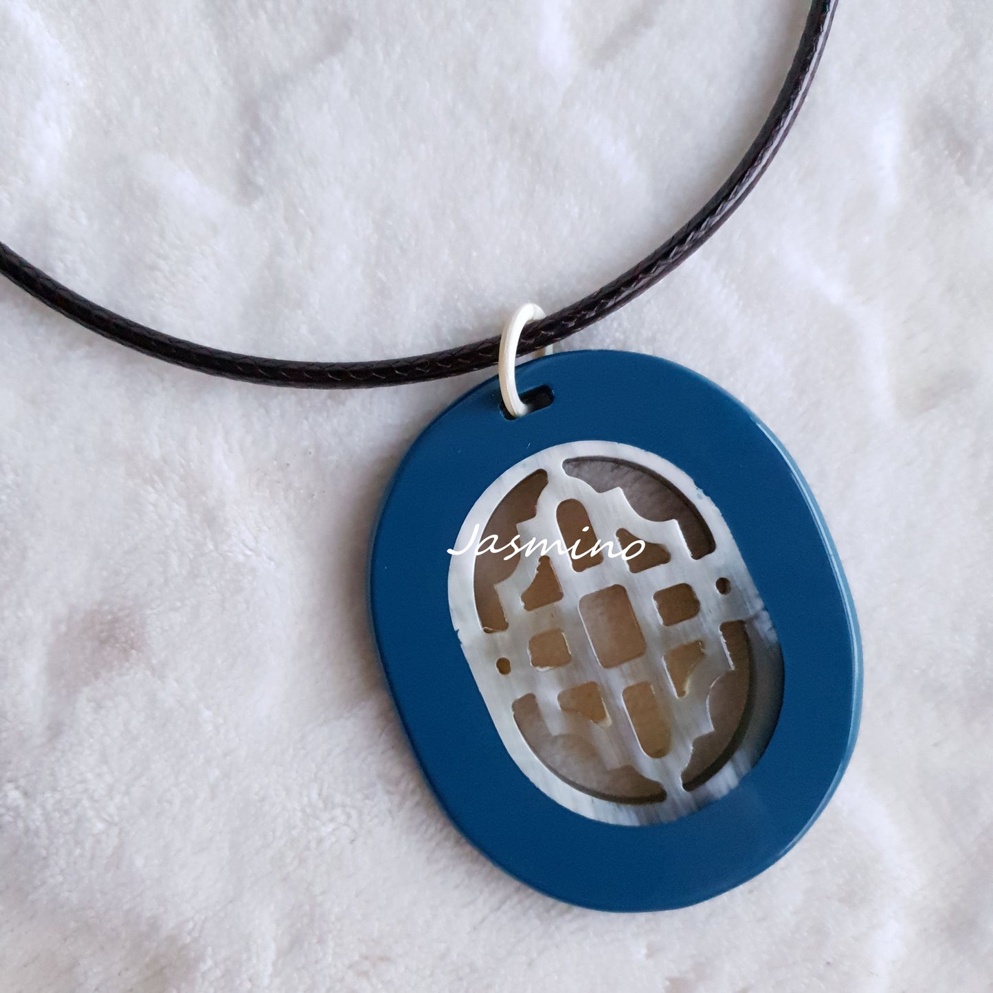 elliptical royal blue necklace on the light background, impressive gift for her