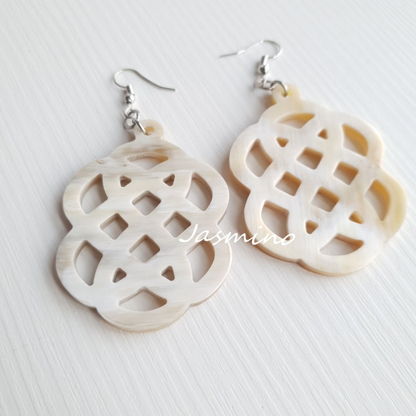 Handmade Asian lantern dangle earrings feature white color in the natural light