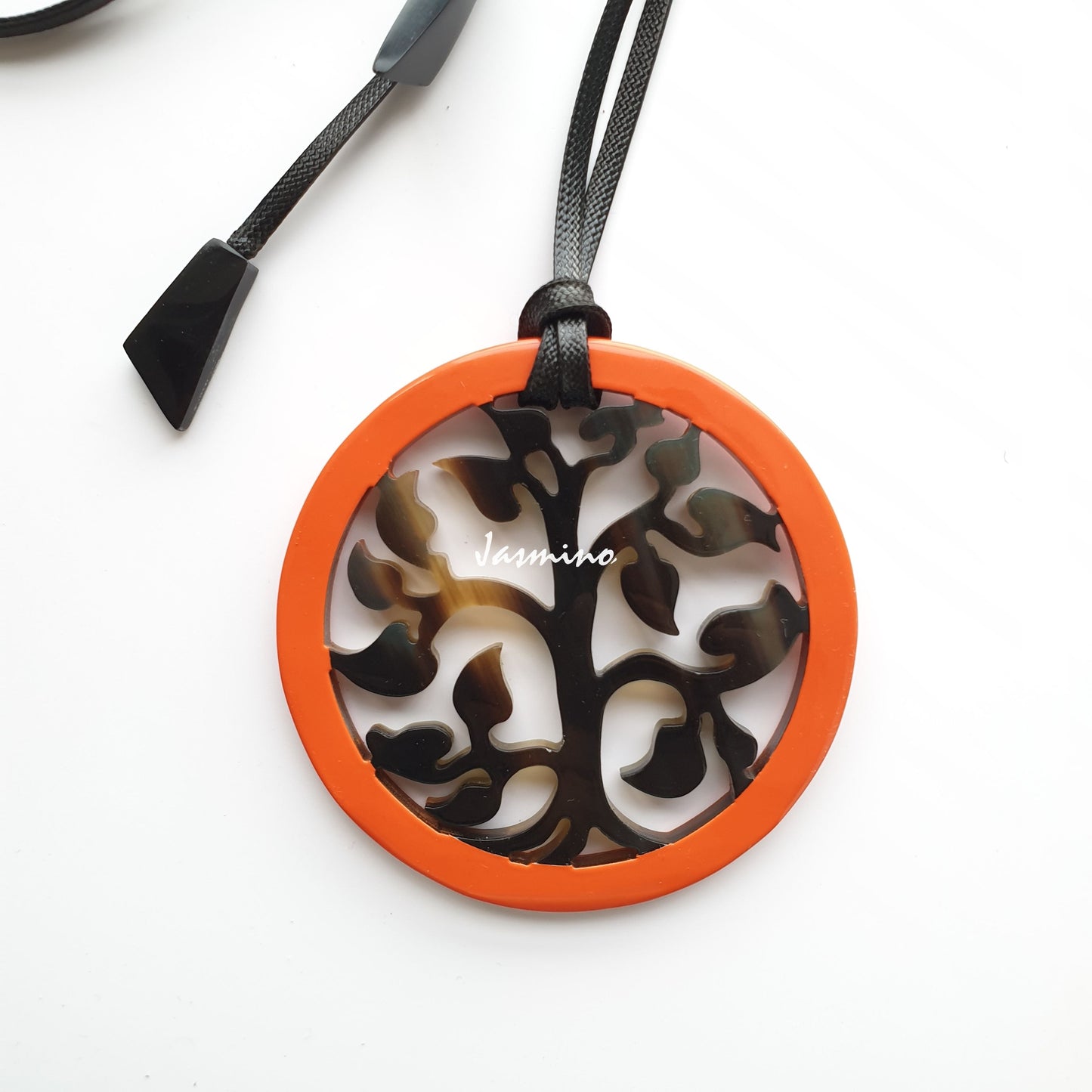 round pendant is designed with orange peel outline, inside with a tree pattern made of unique natural buffalo horn on a light background- 8cm, jasmino.vn