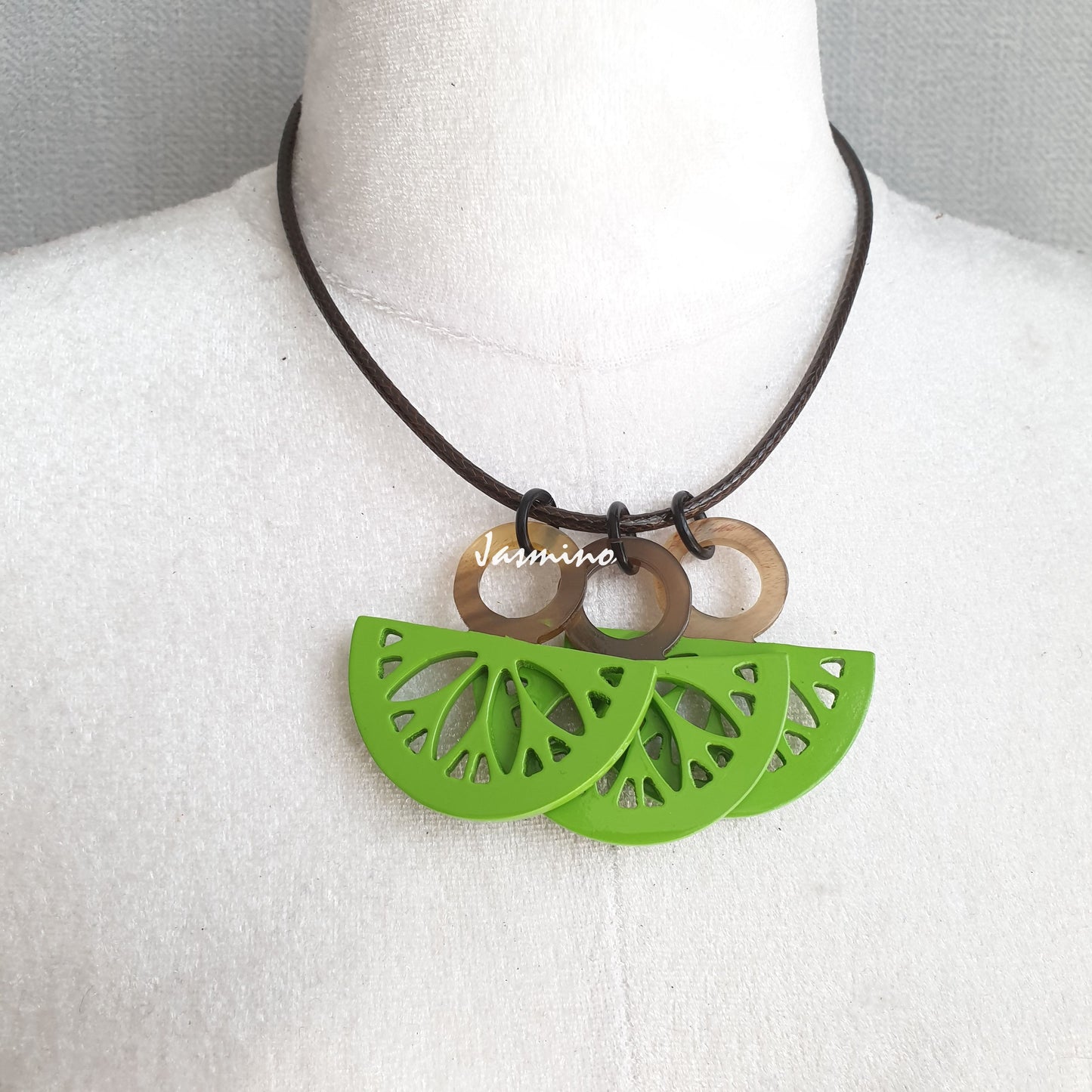 Handmade necklace features bright green with Kiwi fruit shape that are made by superior buffalo horn in the natural light