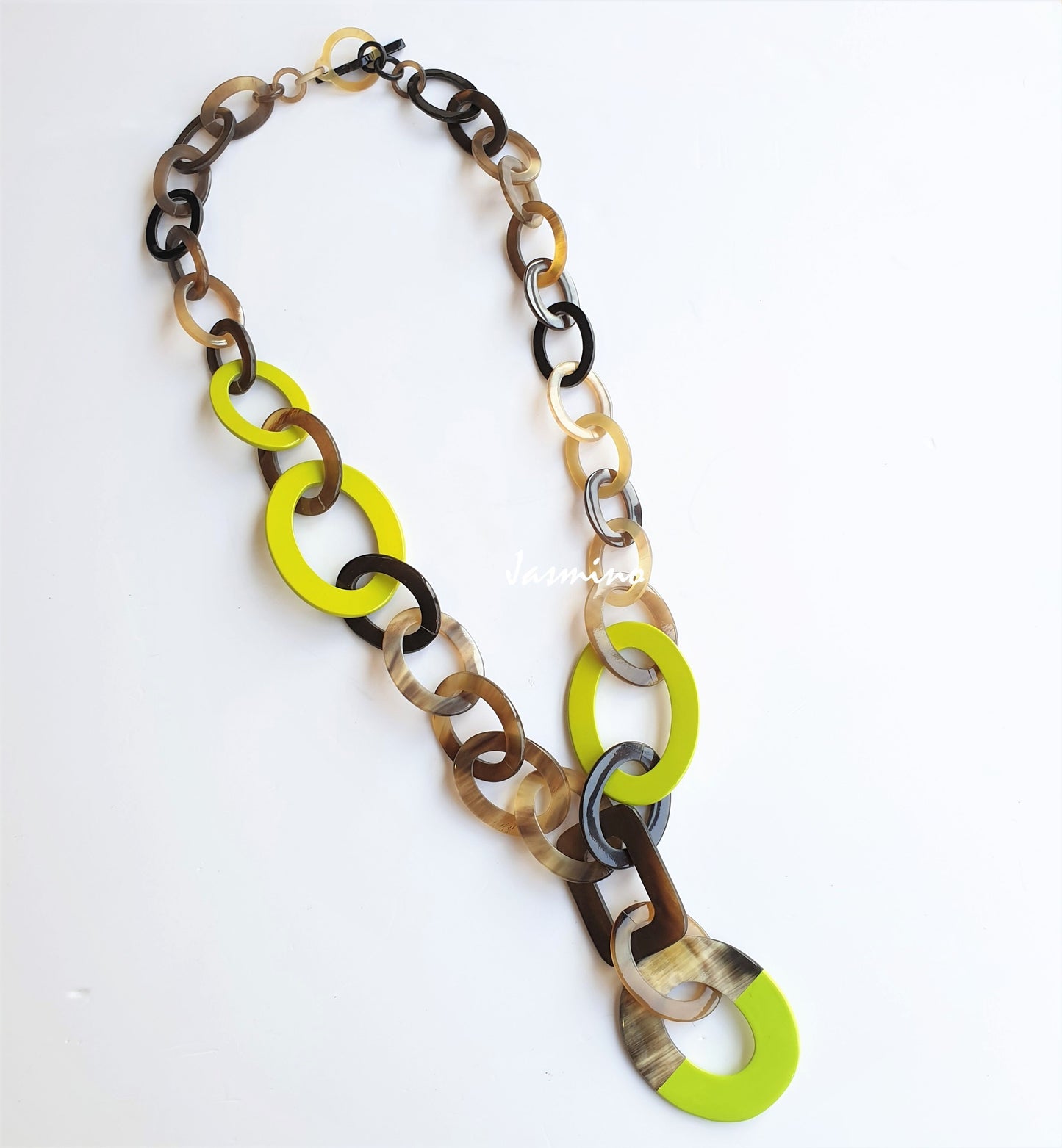 A lemon green wide chain necklace is made by natural buffalo horn on a white background