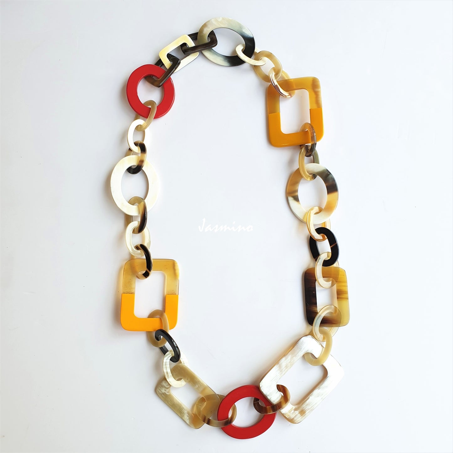 Jasmino unique handmade Bohemian chain link necklace features brown and yellow in natural buffalo horn