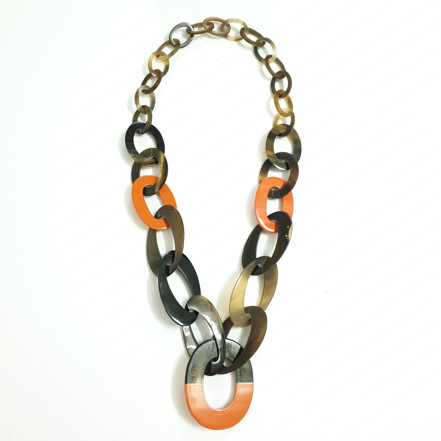 unique handmade Bohemian chain link necklace features brown and orange in natural buffalo horn