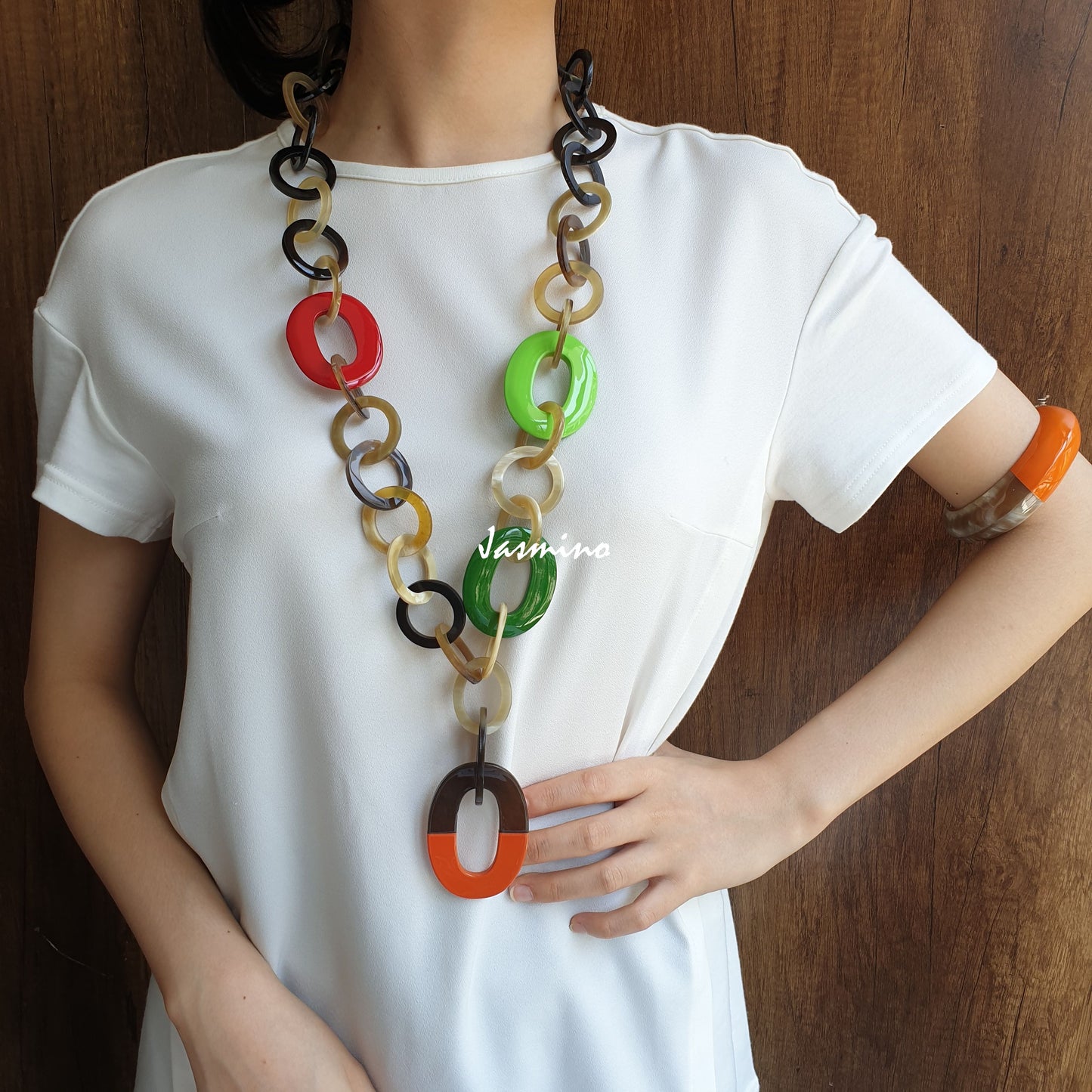 A model is wearing unique handmade Bohemian chain link necklace featured different cultures in natural buffalo horn for women