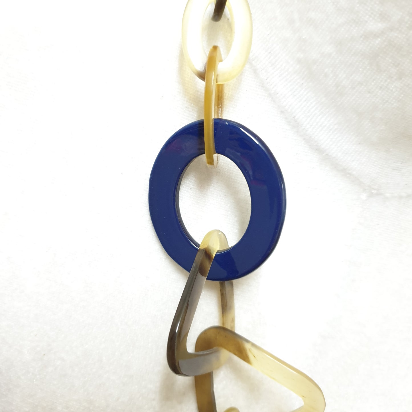 The necklace has some large pieces of classic blue lacquer on a light background, a unique gift for your friend