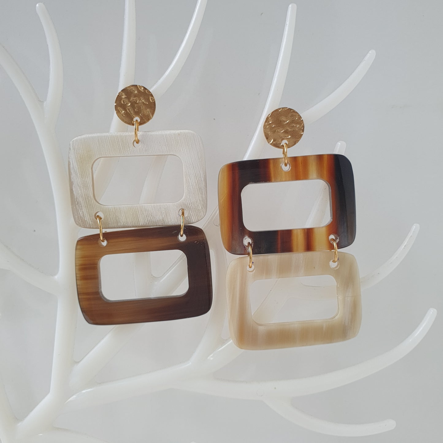 Double rectangle drop earrings are designed by brown and white color with natural buffalo horn on white faux branches