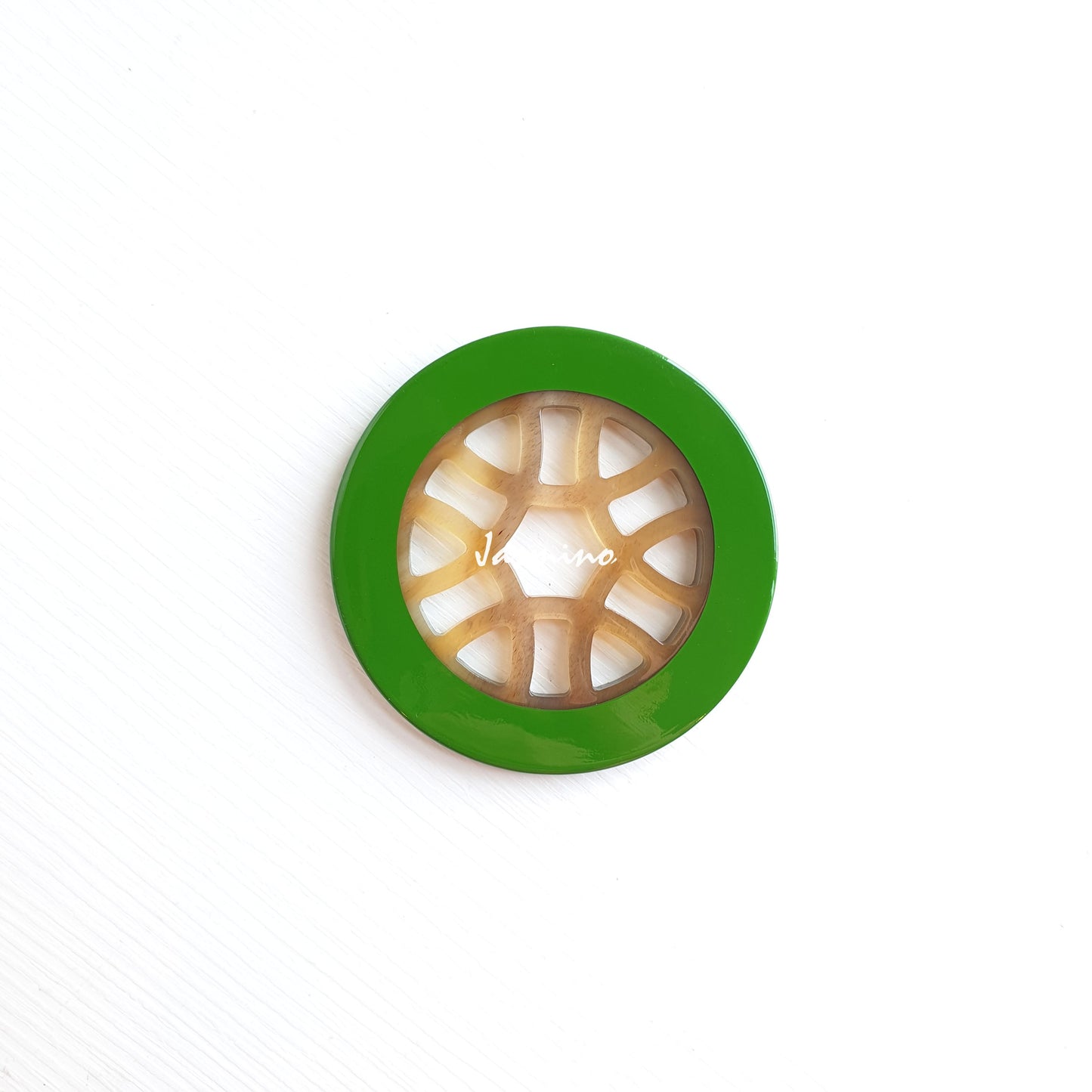 circle pendant is designed with green outline, inside with unique pattern made of unique natural buffalo horn on a light background, a Christmas gift impressive for her 