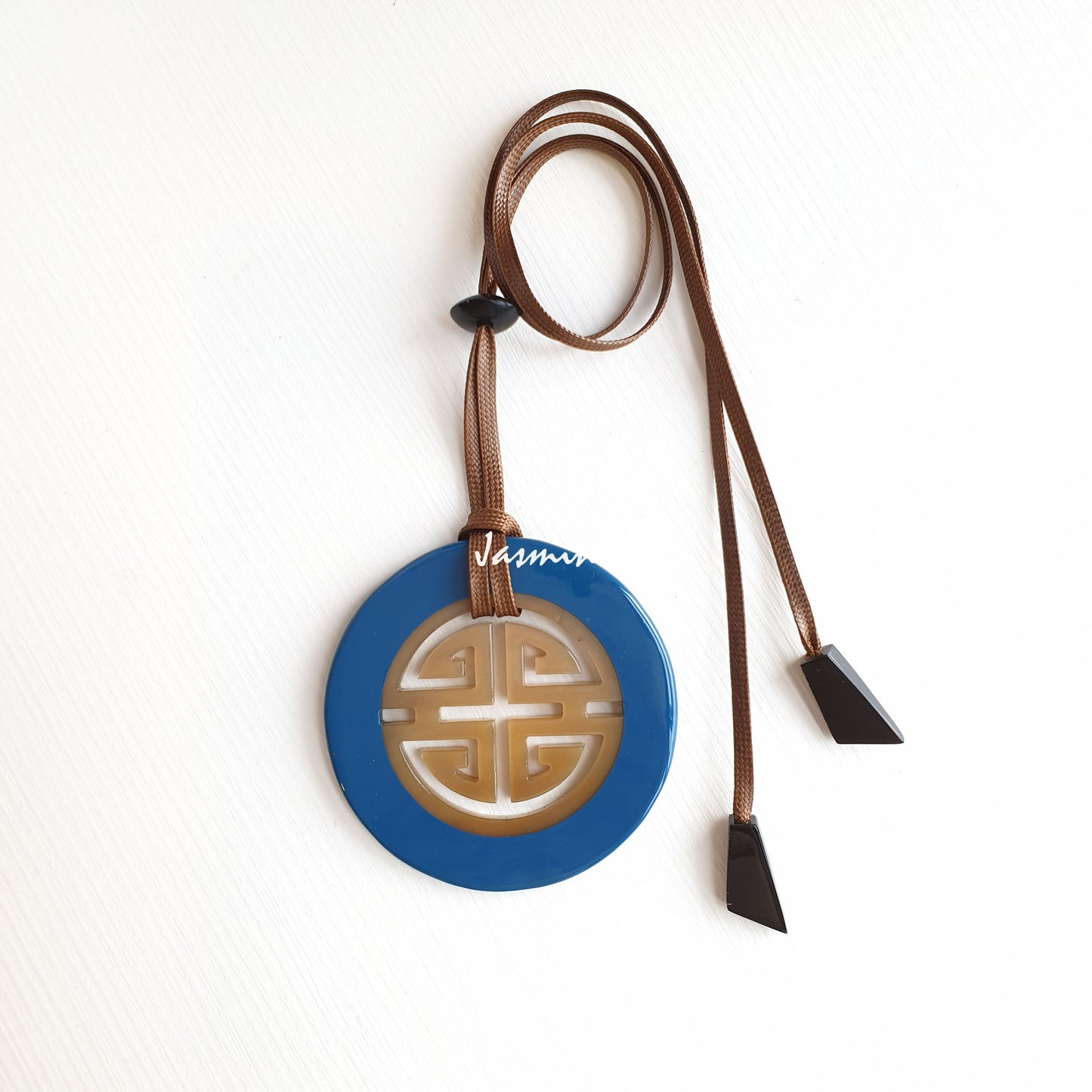 circle cadet blue pendant on the light background, impressive gift for your friends