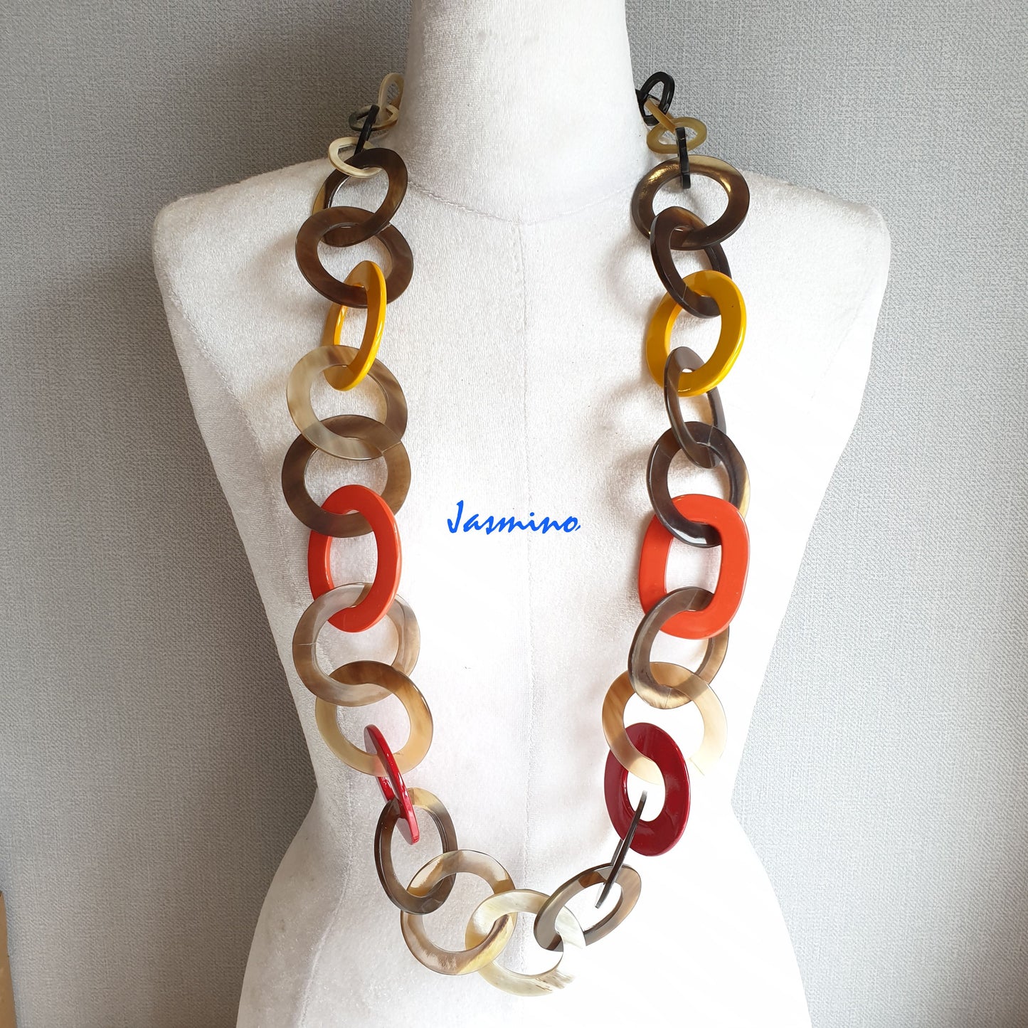 The necklace has several orange, yellow, flame scarlet pieces in natural light, impressive gift for her