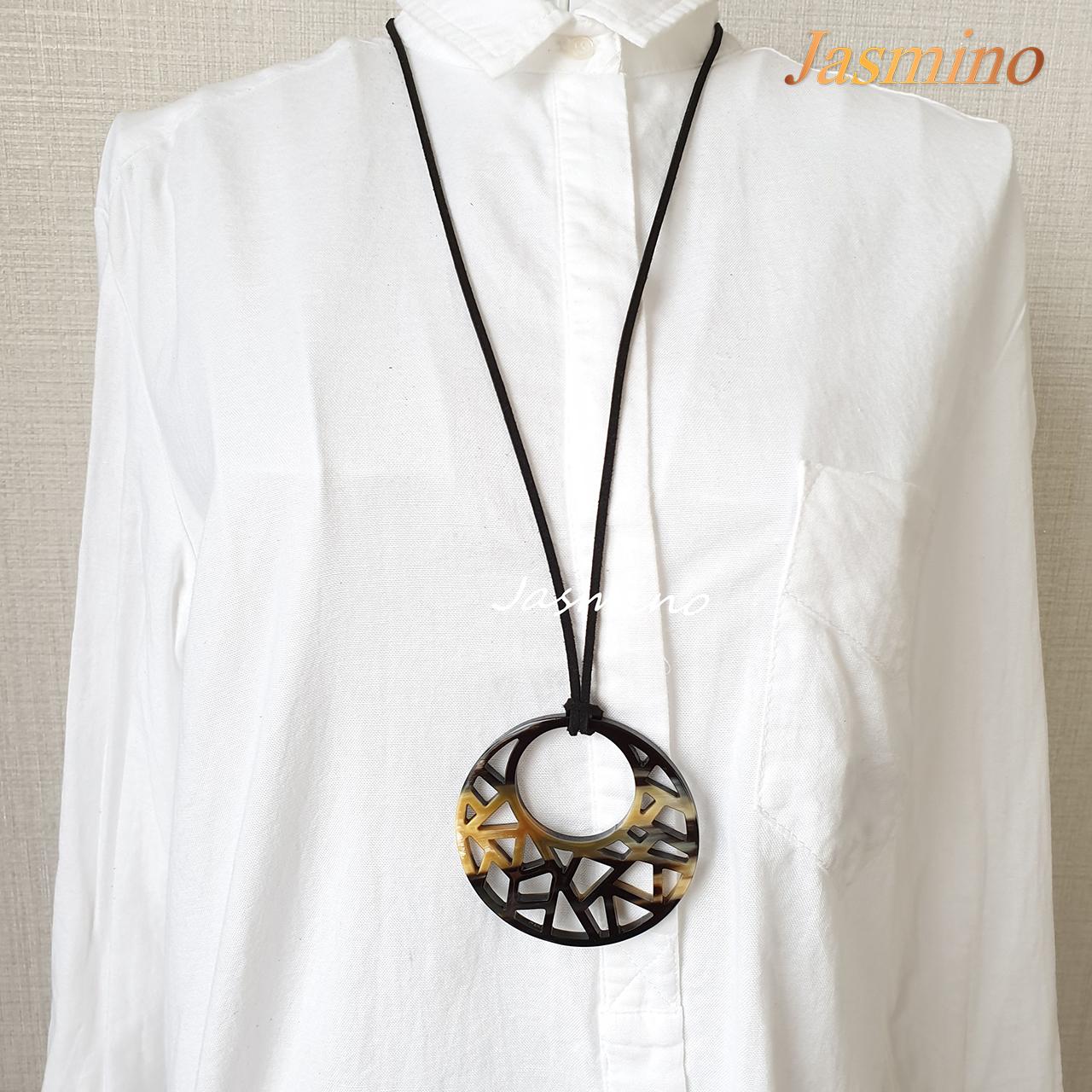 unique round dark buffalo horn lacquer pendant on the light background, jasmino.vn, impressive gift for her