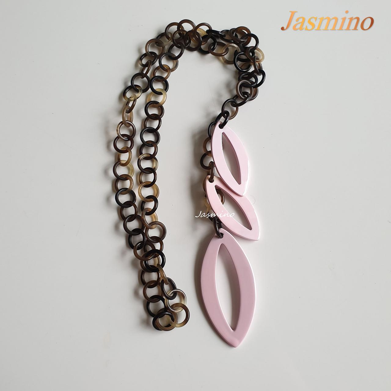 The highlight of this necklace is three large leaf-shaped horns painted rose quartz, an impressive gift for your friend